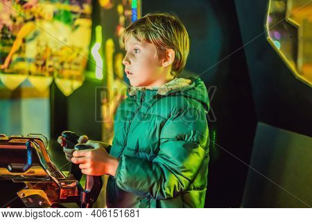 The Boy Is Playing A Slot Machine. Creativity Game Concept