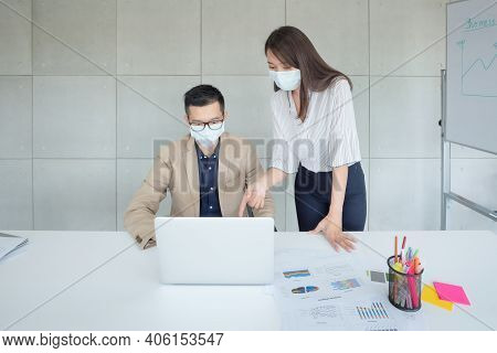 Business Employees Wearing Mask During Work In Office To Keep Hygiene Follow Company Policy.preventi