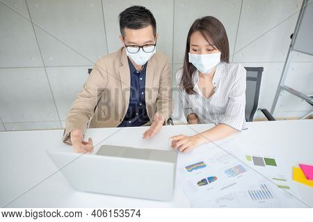 Business Employees Wearing Mask During Work In Office To Keep Hygiene Follow Company Policy.preventi