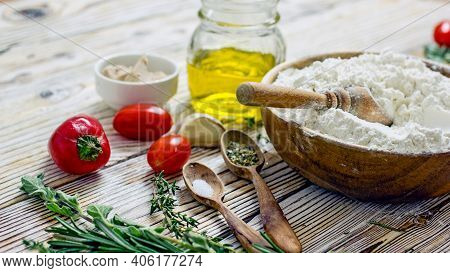 Ingredients For Making Italian Focaccia Bread. Flour, Olive Oil, Yeast, Seasonings, Salt, Tomatoes, 