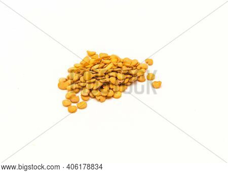Pile Of Eggplant Or Aubergine Seeds In Plastic Container Isolated On White Background