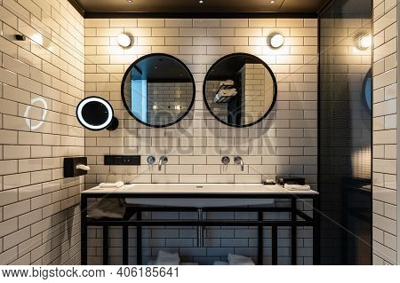 Wroclaw, Poland - March 7 2020 Interior Of A Beautiful Toilet With White Tiles On The Wall And Black