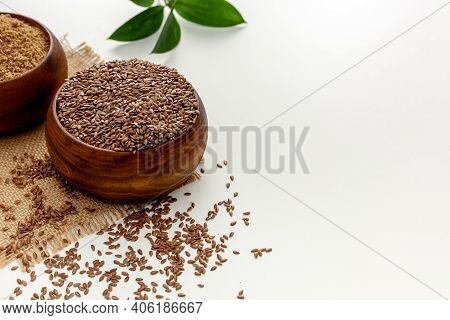 Flaxseeds In A Spoon And Bowl With A Bottle Of Flaxseed Oil And Flaxseed Flour