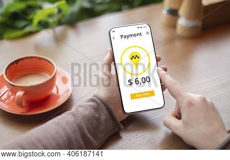 Unrecognizable Woman Booking Taxi Online, Using Mobile Phone Application, Paying For Ride On Web At 