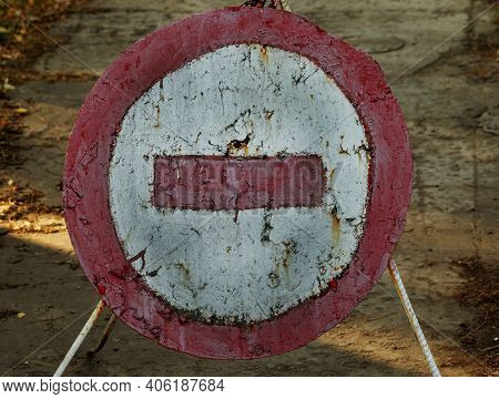 Old Cracked Shabby Road Sign Passage Closed. Brick Is A Road Sign That Blocks Passage On A Dangerous