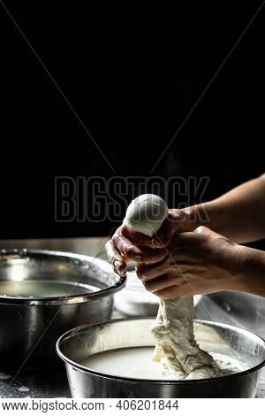 Cheesemaker Preparing Fresh Cheese. The Homemade Cheese Maker Produces Caciocavallo. Pasta Filata, T