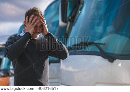 Devastated And Frustrated Transportation Business Owner. Confused Caucasian Men Holding His Head And