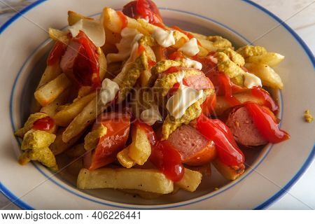 Peruvian Fast-food Salchipapas French Fries And Sliced Sausage