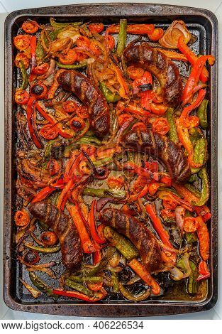 Broiled Sausage Onions And Peppers With Cherry Tomatoes And Thyme