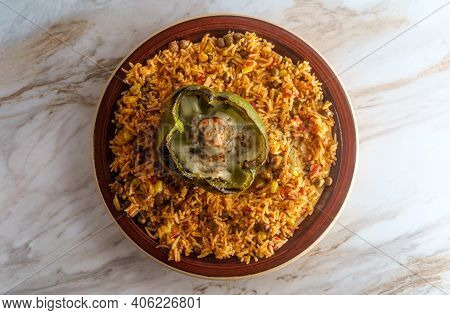 Cheesesteak Stuffed Bell Pepper With Spicy Spanish Pigeon Pea Corn Rice