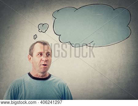 Shocked Middle Aged Man, Big Eyes And Open Mouth Looks Aside Astonished And An Empty Thought Bubble 