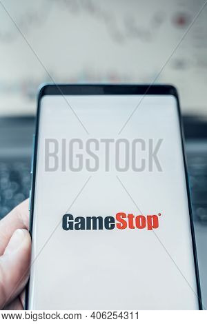 Russia Moscow 02.02.21 Mobile Phone With Logo Of Gamestop In Hand. Company Making Video Games. Playi