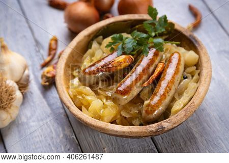 Grilled german sausage links served with sauerkraut or sour cabbage
