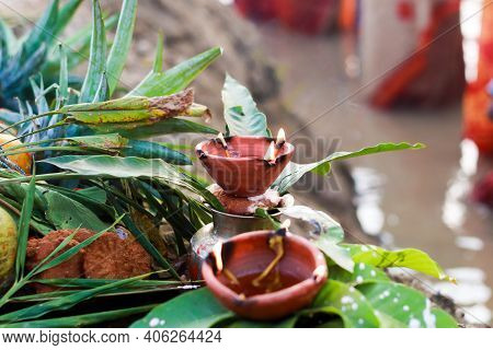 Holy Offerings Of Fruits Flowers Lamps And Cloths In River To Sun God On The Occasion Of Chhath Puja