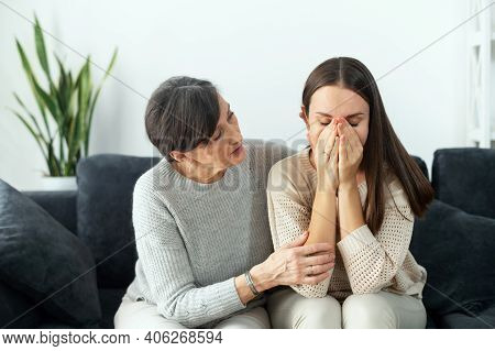 A Senior Loving Mother Supports Upset Depressed Adult Daughter, Caring Mature Mom Embrace Sad Crying