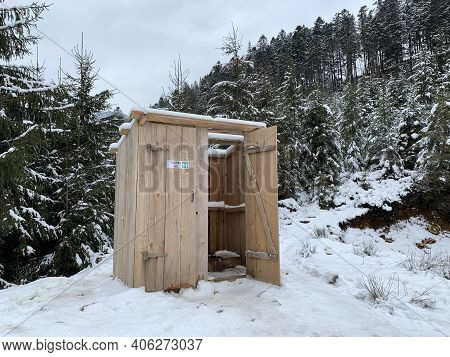 Country Toilet In The Winter Outdoors. Wooden Structure For Outdoor Toilet. Cabin - Toilet In The Fo