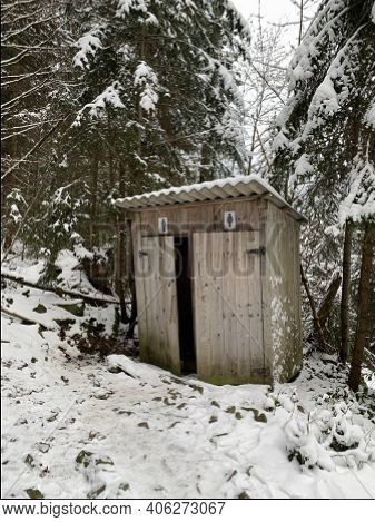 Country Toilet In The Winter Outdoors. Outdoor Toilet Construction. Cabin - Toilet In The Forest On