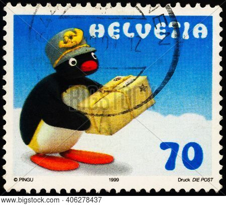 Moscow, Russia - February 01, 2021: Stamp Printed In Switzerland Shows Pingu The Penguin As Postman,