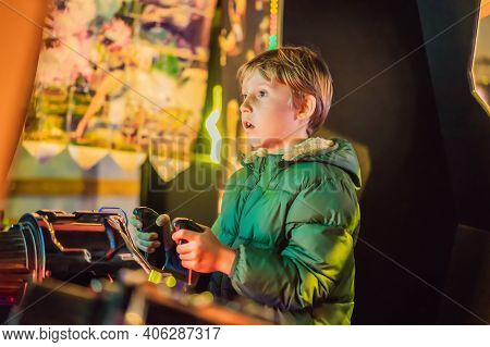 The Boy Is Playing A Slot Machine. Creativity Game Concept