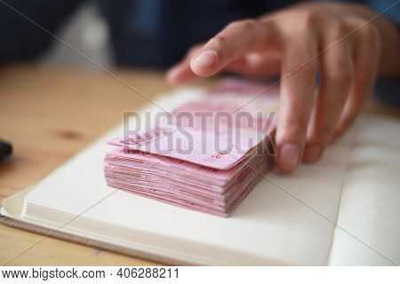 Close Up Of Woman Hand Counting Money Uang Indonesian Rupiah And Making Notes, Money Financial Manag