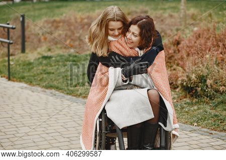 Mother In A Wheelchair With Hre Daughter