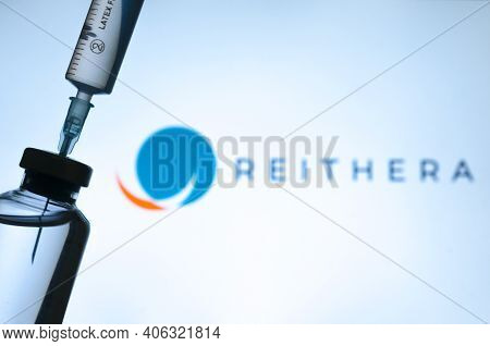 Carrara, Italy - February 03, 2021 - Syringe And Covid-19 Vaccine Vial With Reithera Logo Blurred On