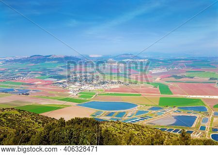  Israel. Jezreel Valley in the Lower Galilee. Picturesque agricultural fields cover the entire valley. The land in the Jezreel Valley is divided between kibbutzim, moshavim and Arab villages.
