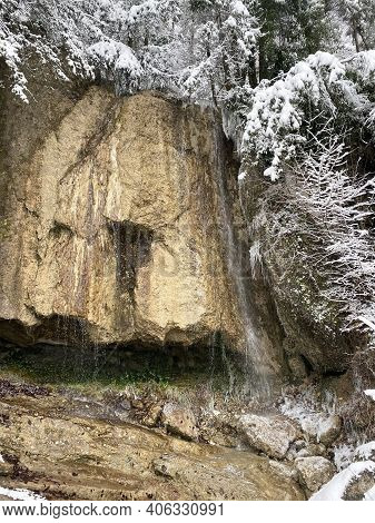 A Small Nameless Waterfall Over A Travertine Rock On The Slopes Of Mountain Rigi In A Winter Setting