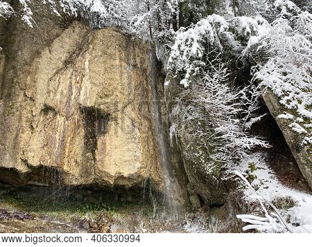 A Small Nameless Waterfall Over A Travertine Rock On The Slopes Of Mountain Rigi In A Winter Setting