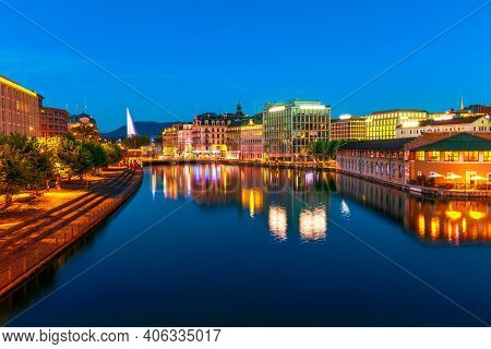 Amazing View Of Geneva In Switzerland By Evening. Jet Deau Fountain And Skyline Of Cityscape From Po