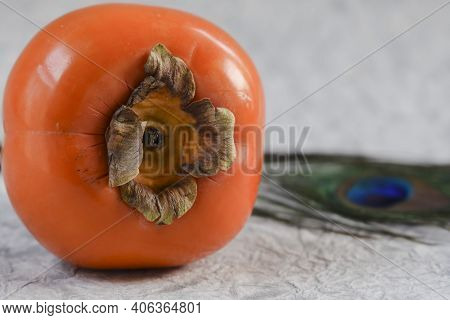 Persimmon Fruit On Black Plate With Woven Bamboo Type Background . Fresh Organic Produce Farm Fresh 