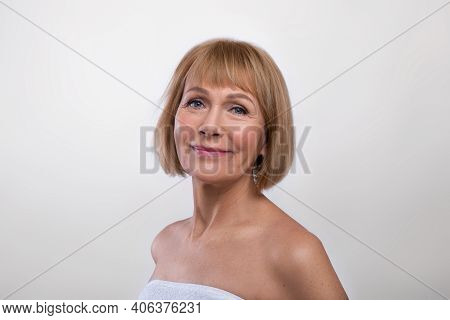 Aging Gracefully. Beauty Portrait Of Lovely Senior Lady Wearing Towel, Having Perfect Smooth Skin, L
