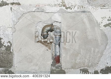 Metal Water Pipe. Old House Plumbing System Background. Grunge Rusty Steel Pipe. Iron Piping In The 