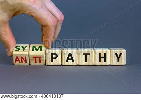 From Antipathy To Sympathy. Businessman Turns Cubes And Changes The Word 'antipathy' To 'sympathy'. 