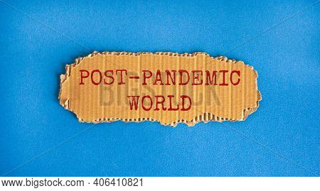 Post-pandemic World Symbol. Concept Words 'post-pandemic World' On Cardboard. Beautiful Blue Backgro