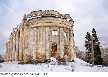 Worship Cross And The Ruins Of Holy Trinity Church In Village Of Fifth Mountain, Leningrad, Russia