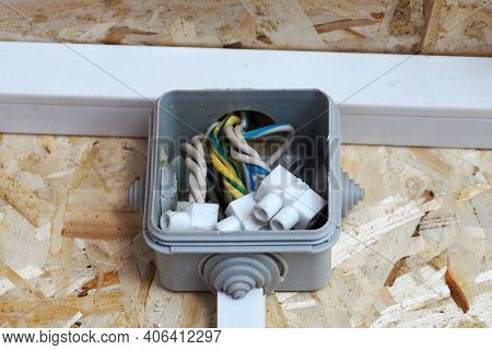 Junction Box On The Wall Made Of Osb Plywood.