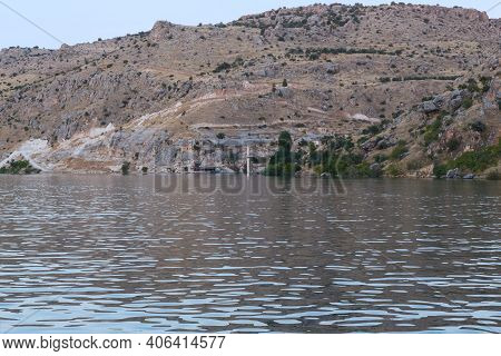 Halfeti, Turkey - October 6, 2020: These Are The Rocky Banks Of The Euphrates River And The Old Town
