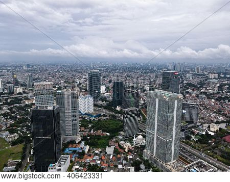 Aerial View Of Bni Life Building In Jakarta And Noise Cloud With Cityscape. Bni Life Is The Best Ins
