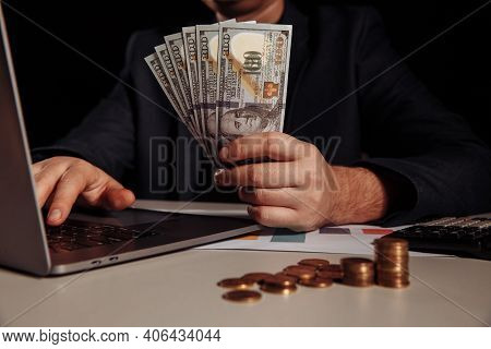 Businessman Earn A Lot Of Money From Internet Online By Only Using Laptop. Investment Concept