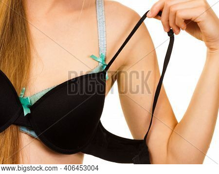 Woman Trying On Black Pushup Bra