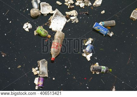 Shiodome Area, Shimbashi, Tokyo, Japan, Asia - April 20, 2010: Trash On A River In Shimbashi, Tokyo