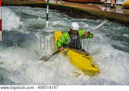 Augsburg, Germany - June 16, 2019: Whitewater Kayaking, Extreme Kayaking. A Guy In A Kayak Sails On 