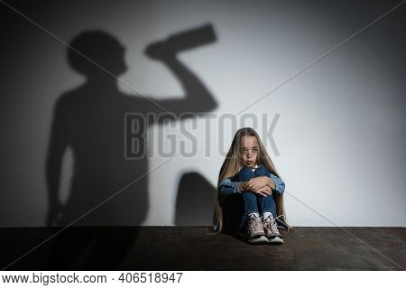 Domestic Physical Violence, Abusing. Scared Little Caucasian Girl, Victim Sitting Close To White Wal