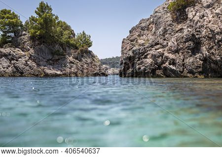Big Rock In The Blue Waters Of Stafilos Beach, Skopelos, Skopelos Island, Greece.