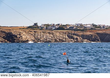 Coast With A Village View From The Sea In Brittany