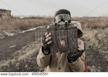 Wandering Boy. Boy With A Gun. Boy Goes To An Abandoned Building. Boy Stands In Front Of A Building.
