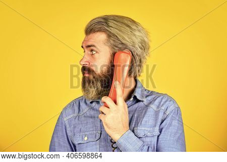 Bearded Hipster Man Phone Conversation. Successful Negotiations. Retro Phone. Marketing Automation. 