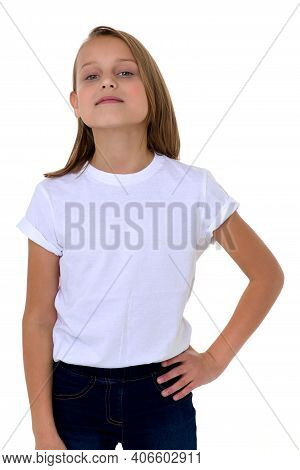 Blonde In A White T-shirt. Pretty Stylish Girl Posing In Studio On A White Background. Close-up Port