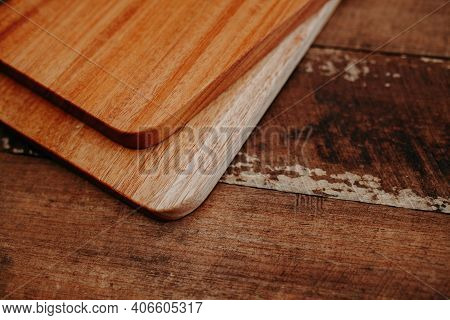 Set Of Wooden Cuttng Boads On Wooden Background. Wooden Kitchen Block Close Up.